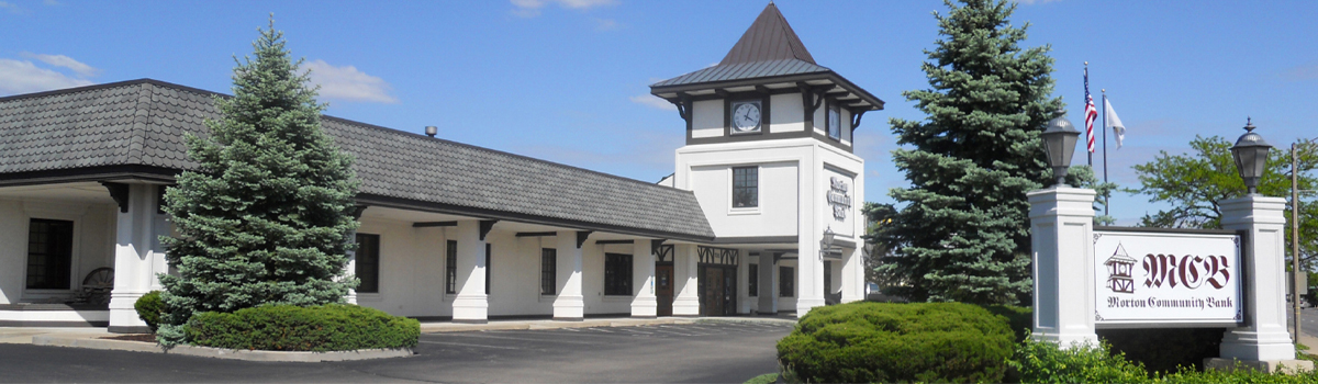 A large white building with a clock tower - Morton Community Bank - Morton Illinois